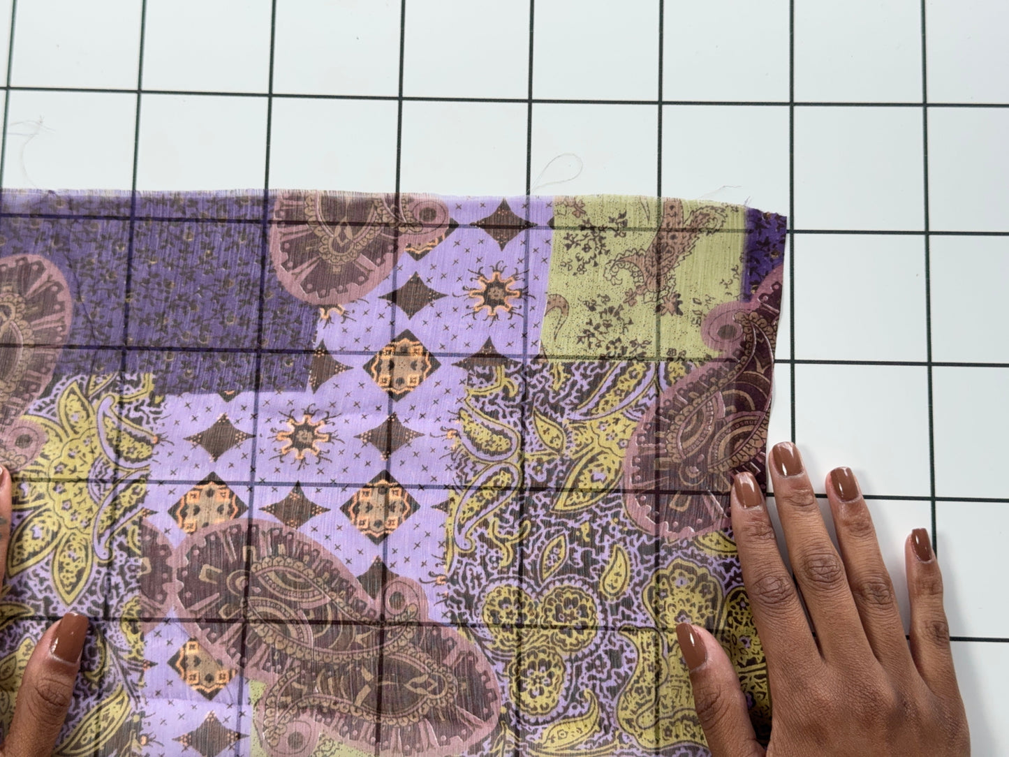 Patterned fabric on a white grid background