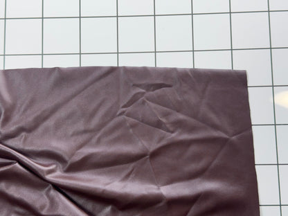 Plum Colored fabric on a white grid background