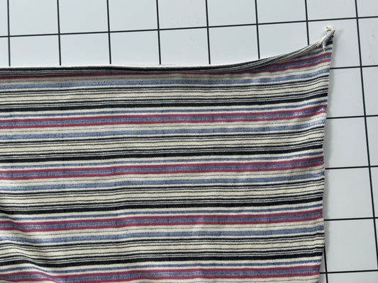 Striped fabric on a grid background